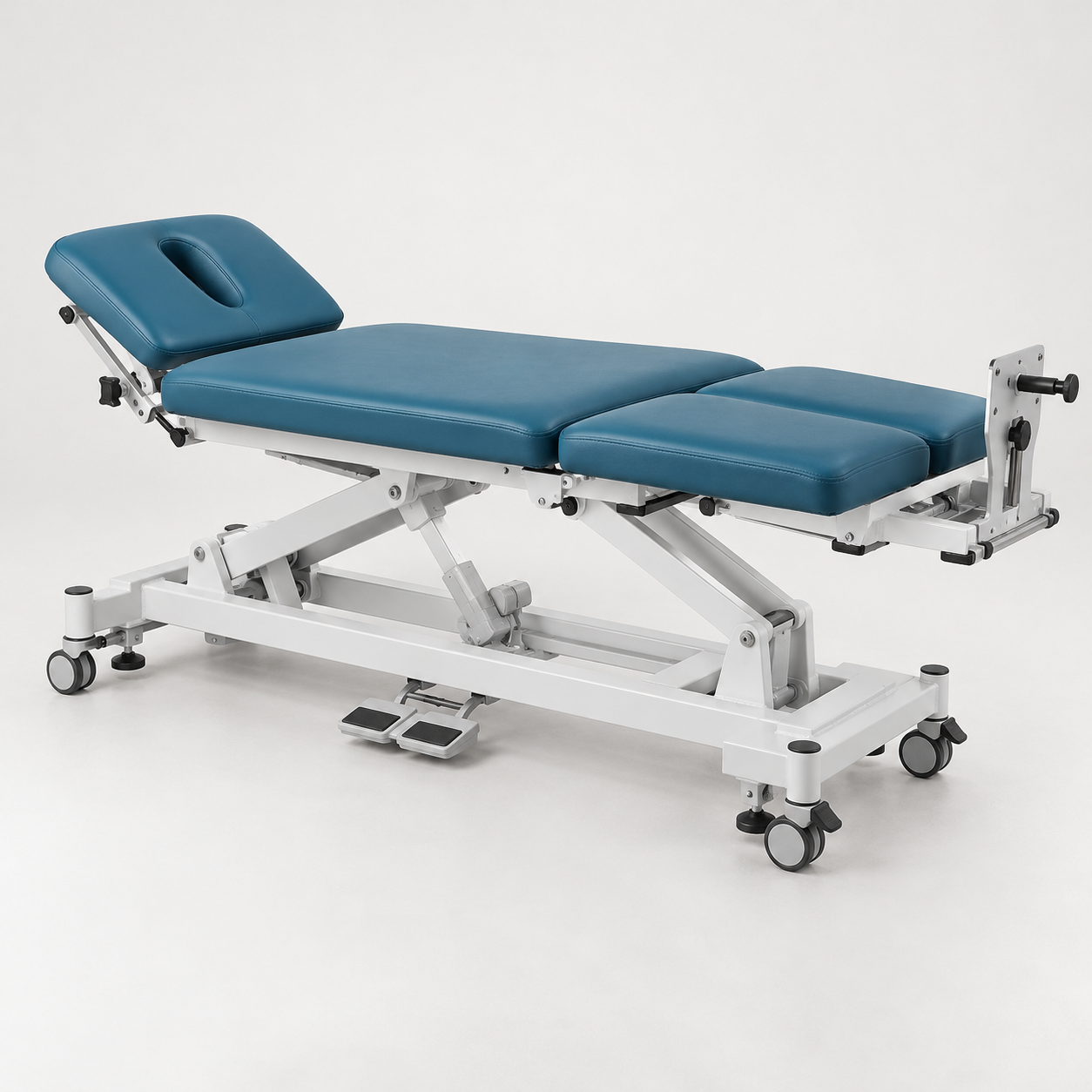 Four-section physiotherapy traction table with adjustable head section, traction mount and foot controls