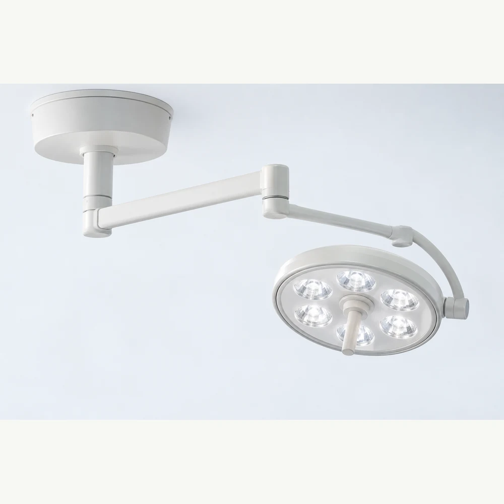 Single-head LED minor surgical light on an articulated ceiling arm