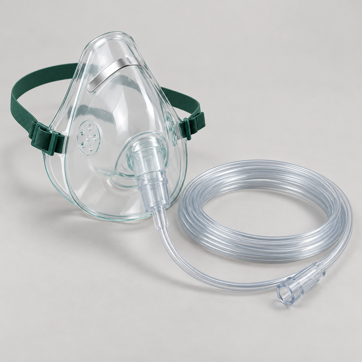 Transparent adult oxygen face mask with a head strap and coiled oxygen tubing