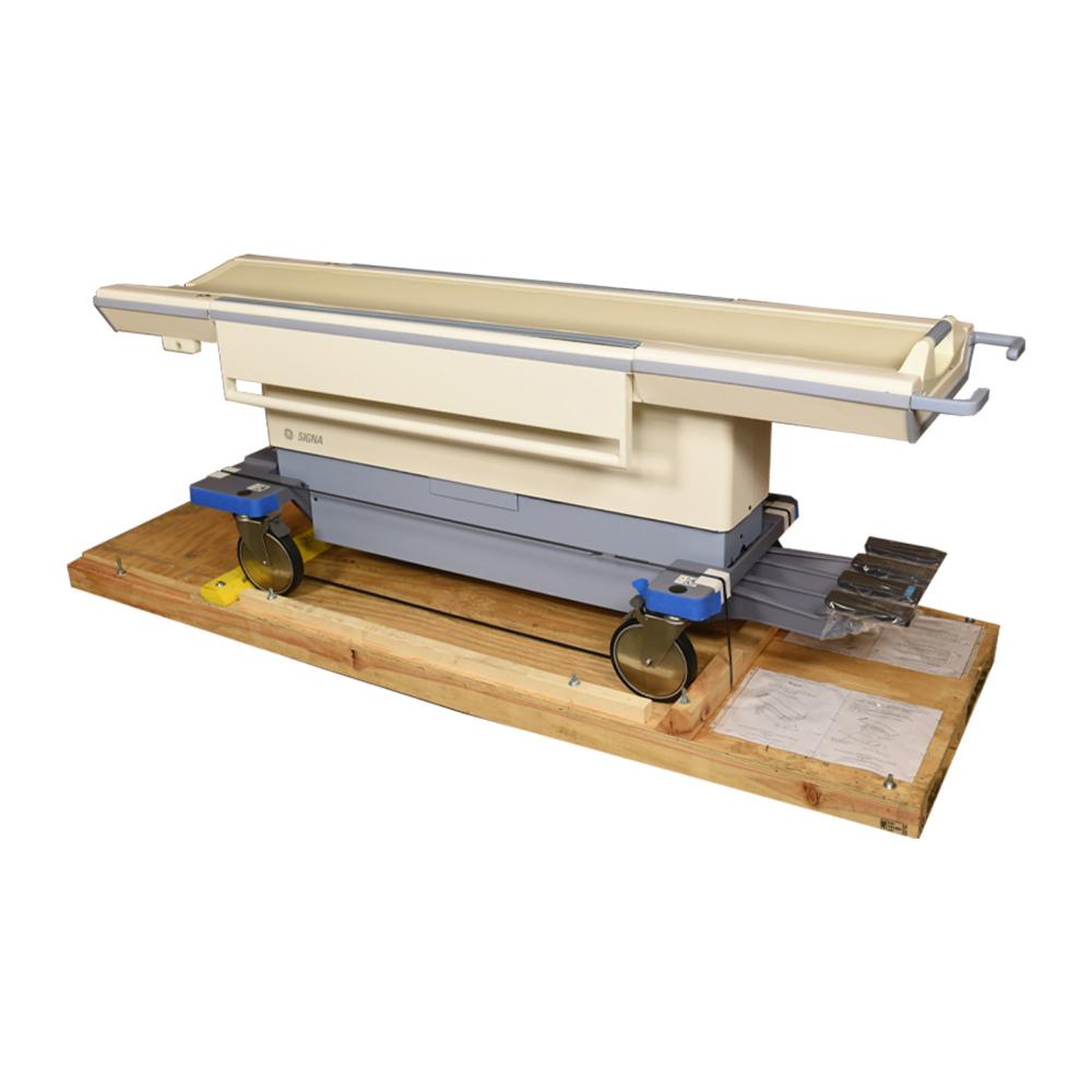 GE HealthCare MRI patient table assembly 5127223-3 on a shipping base, exact official Service Shop product photograph