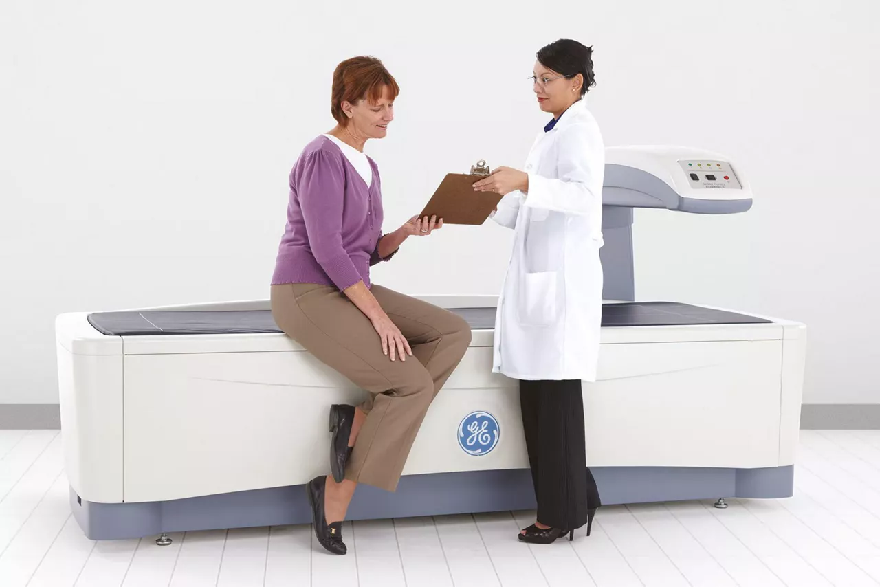 GE HealthCare Prodigy DXA bone densitometry system in a clinical room, manufacturer image