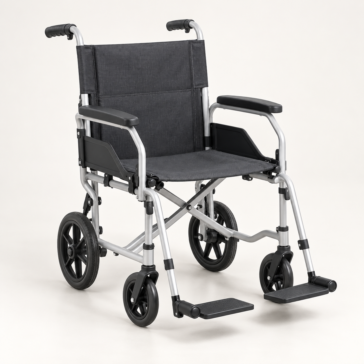 Folding manual wheelchair with a silver frame and dark seat
