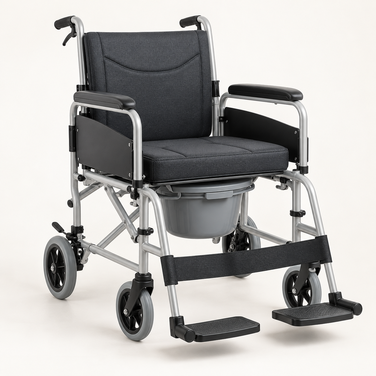Folding wheelchair with an integrated commode vessel and silver frame