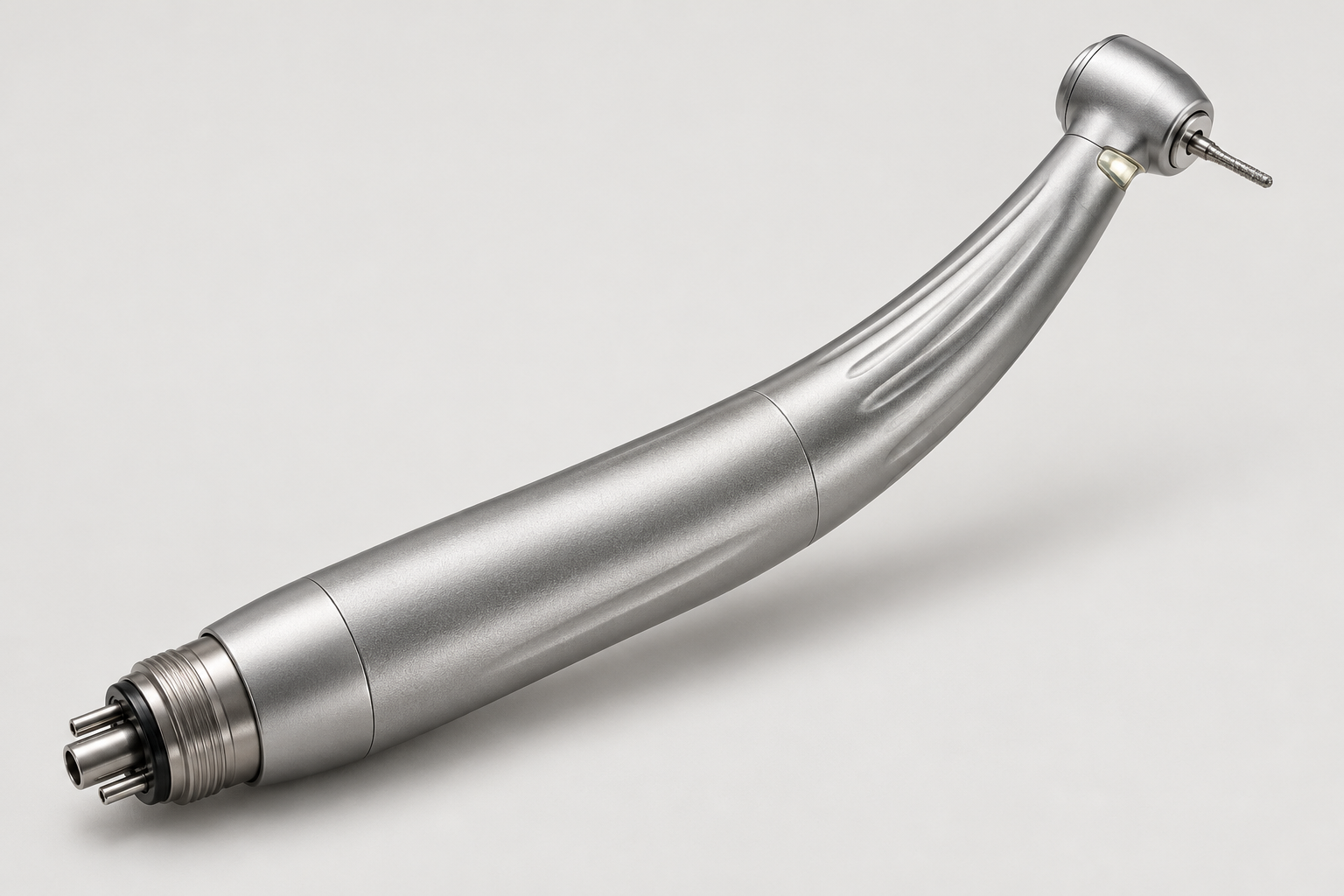 High-speed dental turbine handpiece with compact angled head and light guide