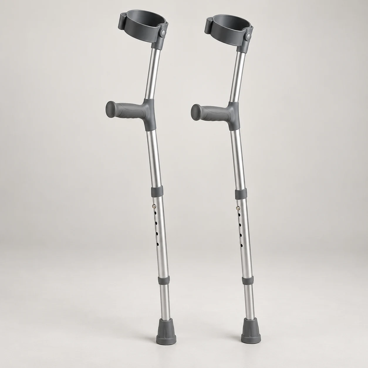 Pair of adjustable aluminium forearm crutches with closed cuffs and ergonomic grips